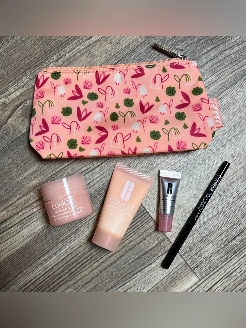 CLINIQUE Travel Bundle - Moisture Surge Hydrators, Eye Serum, Gel Eyeliner + Bag